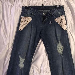 Blue jeans with crochet patches